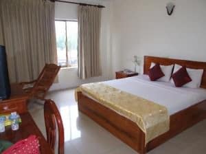 Indochine 2 Hotel room and bed view