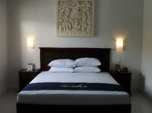 The Niche Bali Hotel room and bed
