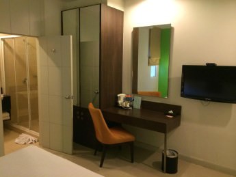 Legacy Express Bangkok TV with desk area and bathroom
